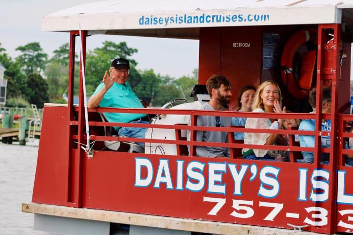 a group of people standing in front of a sign