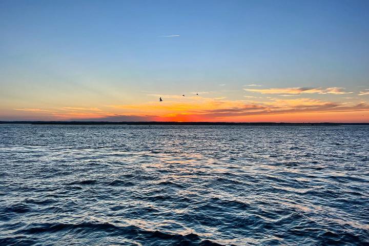 a sunset over a body of water