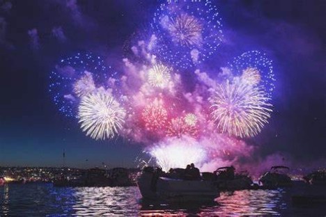 a group of fireworks in the water